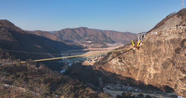 Scenic View of a Suspension Bridge across a Valley