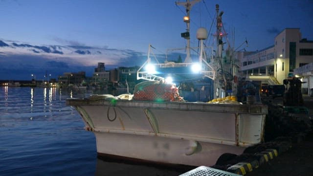 Fishing Vessel Docked at Twilight Harbor