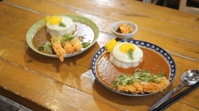 Plate of curry rice with fried cutlet and fried shrimp