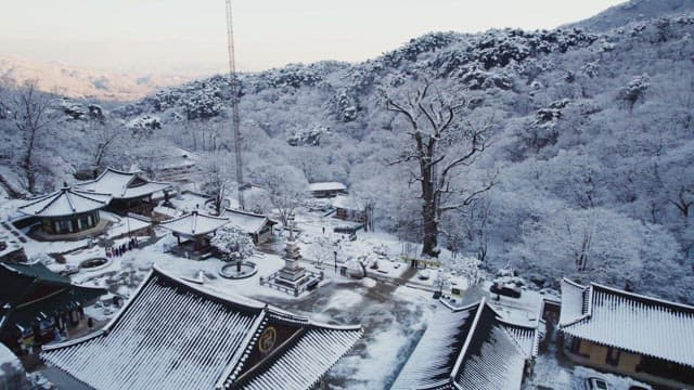 Snow-covered traditional Korean temple