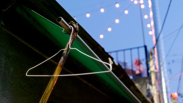 Wire hanger on a rooftop with lights