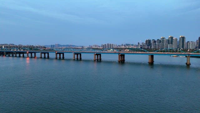 City skyline with a bridge over a river