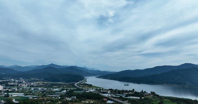 Scenic river with a bridge and mountains