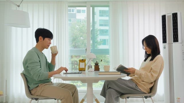 Couple sitting and relaxing in a bright living room
