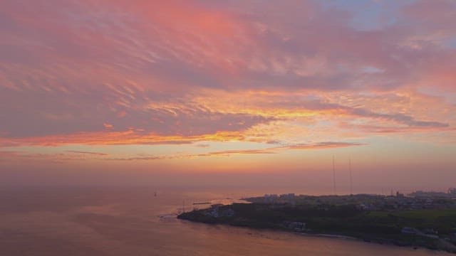 Serene coastal town at sunset