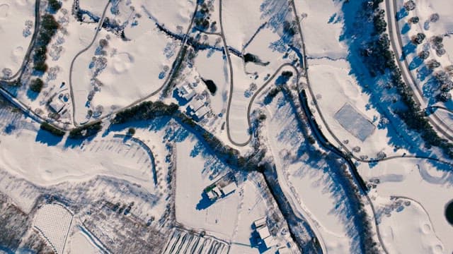 Snowy Mountain Landscape with Winding Roads