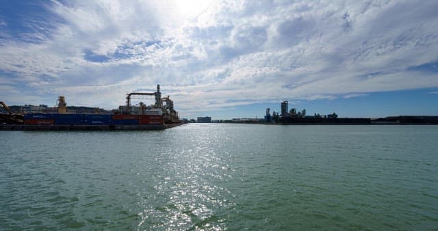 Industrial complex near the sea under blue sky