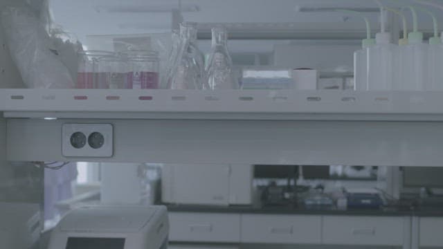Female student washing hands at the sink in the science lab