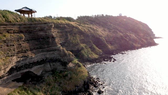 Jeju sea on a sunny day with columnar joints