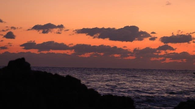 Boat Sailing Sea during Stunning Sunset