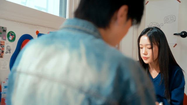 Two people enjoying pizza indoors