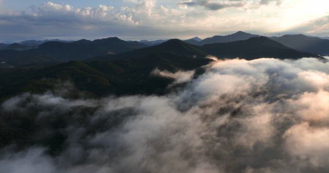 Mountains covered in clouds at sunrise