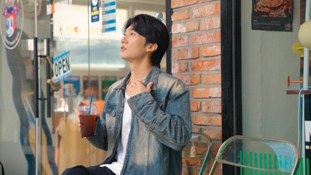 Young man relaxing and drinking coffee