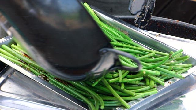 Stir-fried garlic stems seasoned with soy sauce