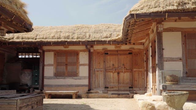 Front Yard of Quiet Traditional Thatched House on a Sunny Day