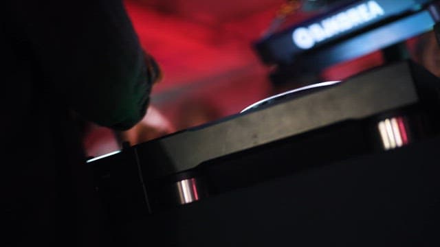 DJ Performing among the Dizzying Lights