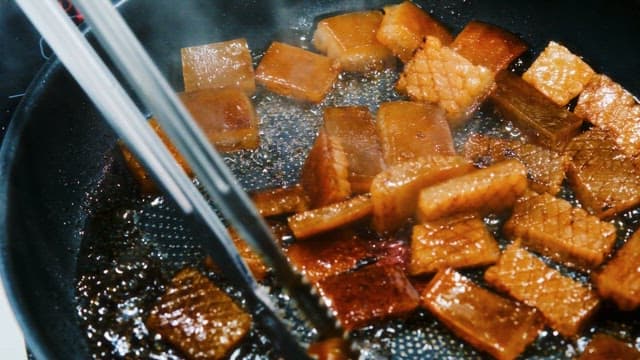 Pork Rind Sizzling in a Pan