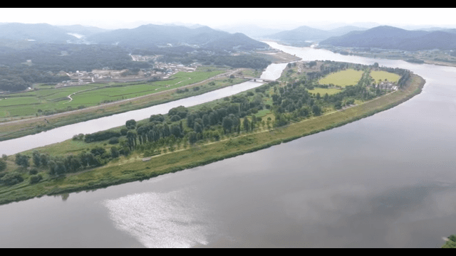 Scenic river winding through lush greenery