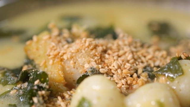 Rice cake balls of thick glutinous rice dumplings with sesame seeds and seaweed