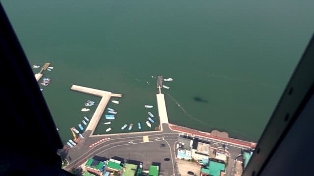 Coast from a helicopter cockpit on a clear day