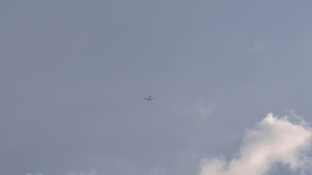 Airplane flying high in the sky