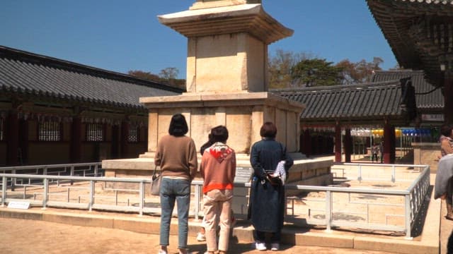 Tourists observing Dabotap Pagoda, a relic of Bulguksa Temple on a sunny day