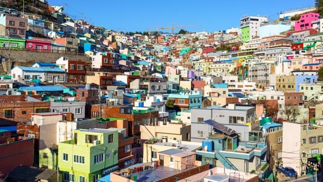 Day to night view of a Gamcheon Culture Village with colorful residential buildings