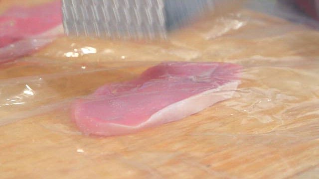 Tenderizing meat with a mallet