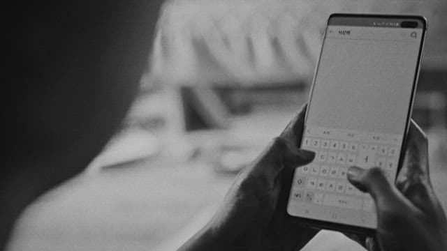 Person Browsing Information about Crime on a Smartphone