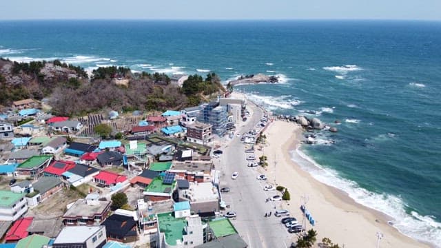 Coastal Village Alongside a Sandy Beach