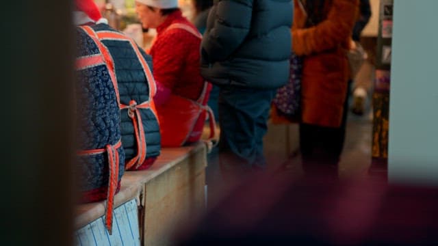 People in winter clothing at a market