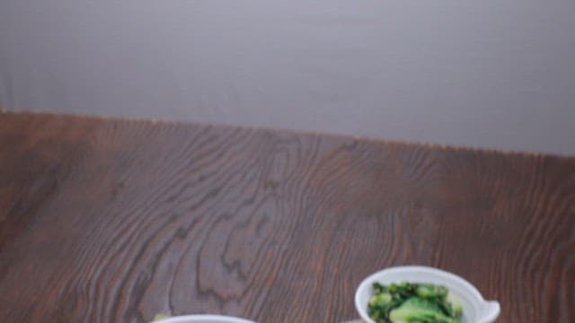 Bibimbap with vegetables and egg on a table