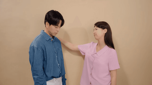 Woman comforting a man with a worried expression