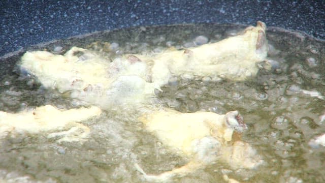 Frying oyster mushrooms in a pan with oil