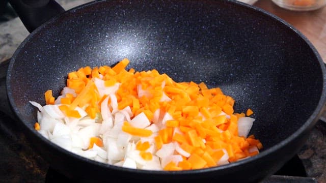 Chopped vegetables and meat in a pan