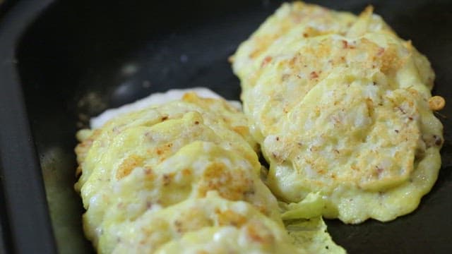 Delicious Korean Pancakes Cooking on a Pan