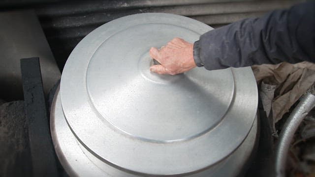 Bamboo shoots being boiled in a large nickel silver cauldron