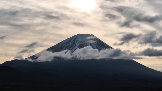 Mount Fuji silhouette with cloudy sky