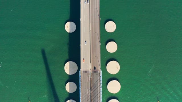 Incheon bridge over green water with vehicles