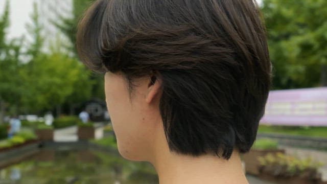 Young man smiling in a park