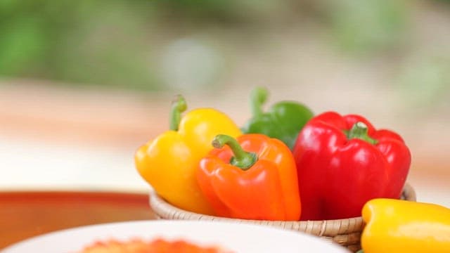 Plate of pasta plated with fresh bell pepper