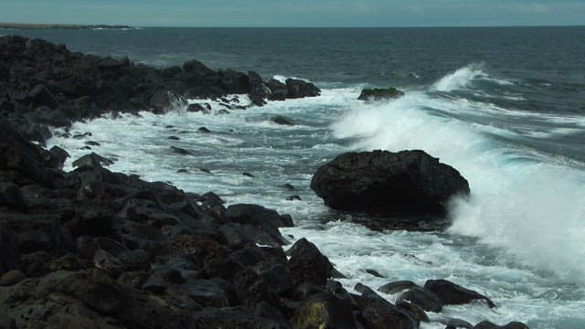 Waves Crashing on Rocky Coastal Shoreline