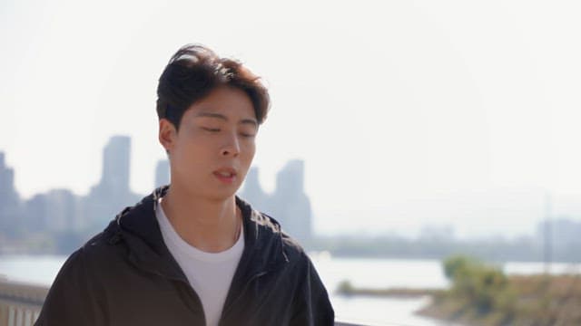 Man drinking water while jogging