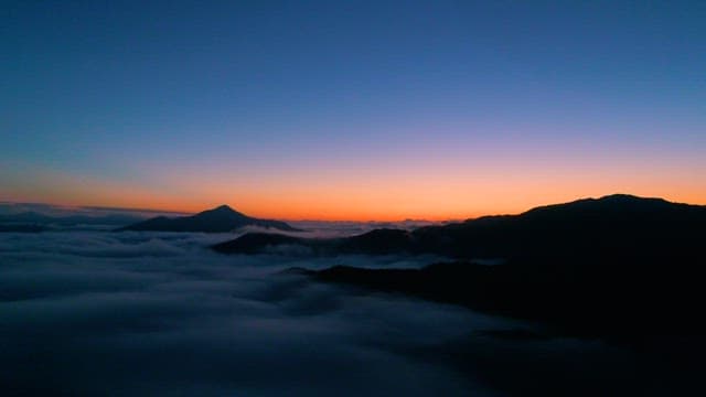 Dawn Breaks over Misty Mountains