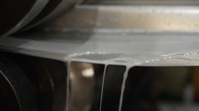 Liquid material flowing through machinery