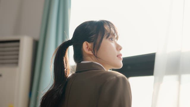 Student looking out the classroom window