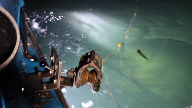 Fishing equipment on a boat at night