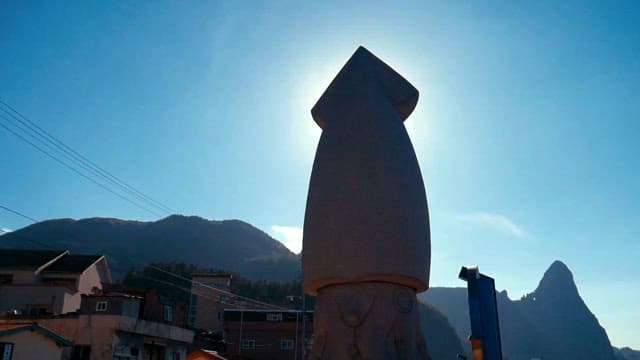 Silhouette of a sculpture against the sky