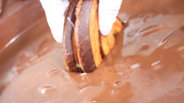 Dipping Pastry into Chocolate Fondue