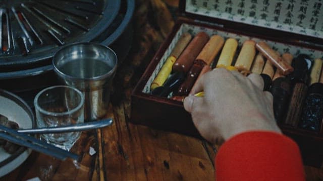 Person Stamping Seal on Documents about Loan